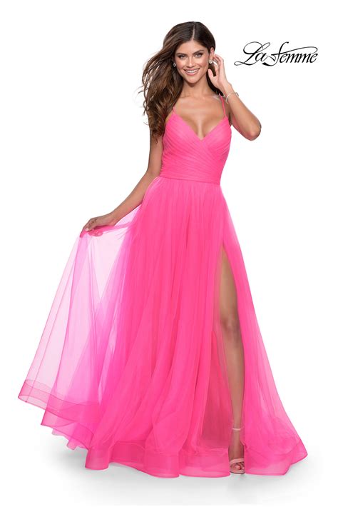 La femme prom dresses 2023 - Color. Black. White. Share on. FIND STORES NEAR ME. One shoulder sequin gown with ruched design on front and side leg slit. Open back and strap that goes across. Back zipper closure. Style comes in neon pink under number 29654.